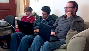 Three students working on their laptops