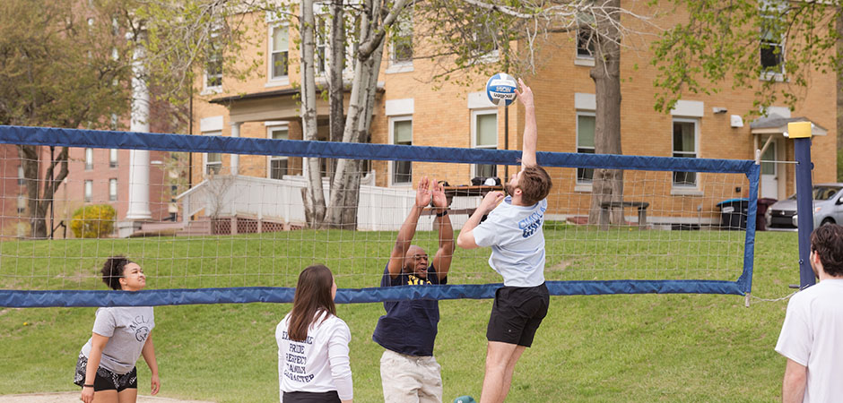 MCLA students playing volleyball outdoors
