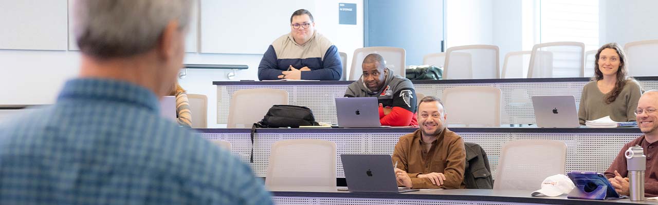 MBA classroom students engaging withe speaker