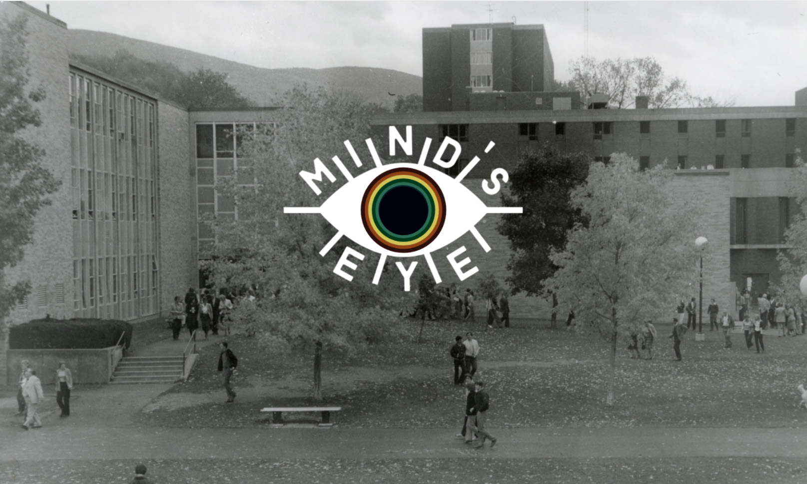 Mind's eye logo over old picture of students walking over lawn