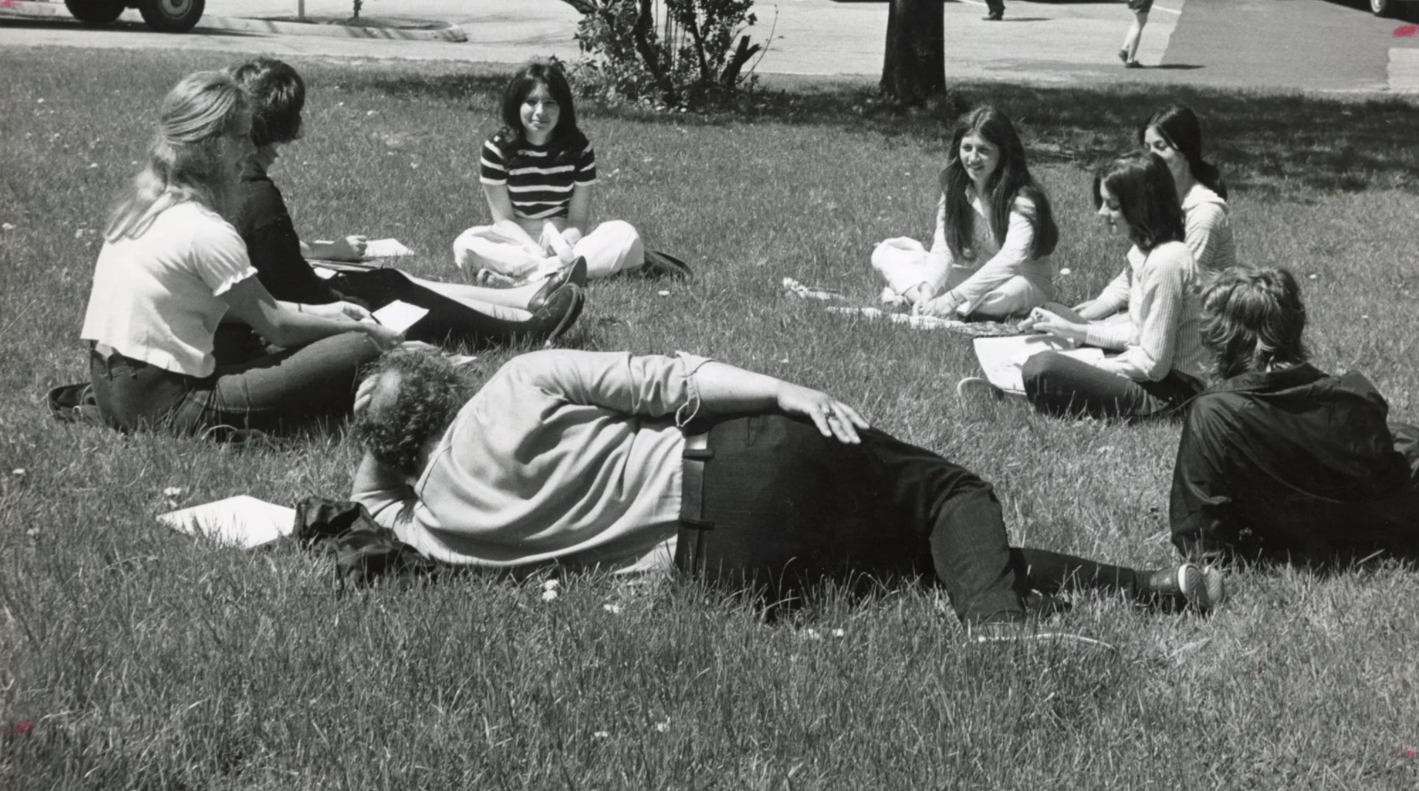 Students seated on lawn