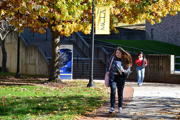 MCLA campus student walking 